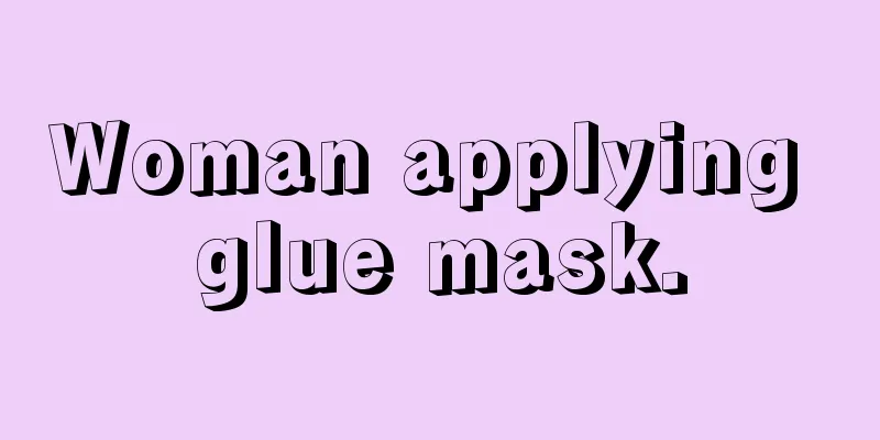 Woman applying glue mask.