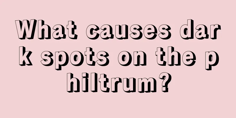 What causes dark spots on the philtrum?