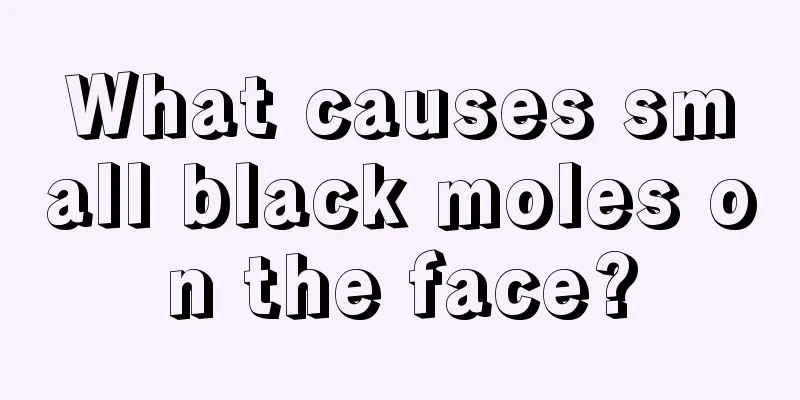 What causes small black moles on the face?